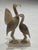An exceptional late-20th-century modernist stone sculpture depicting a stylized pair of wading birds, meticulously hand-...
