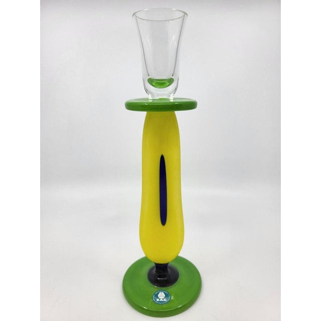 The Ercole Barovier and Ermanno Toso candle holder is more than just an accessory; it's a work of art in blown glass,...