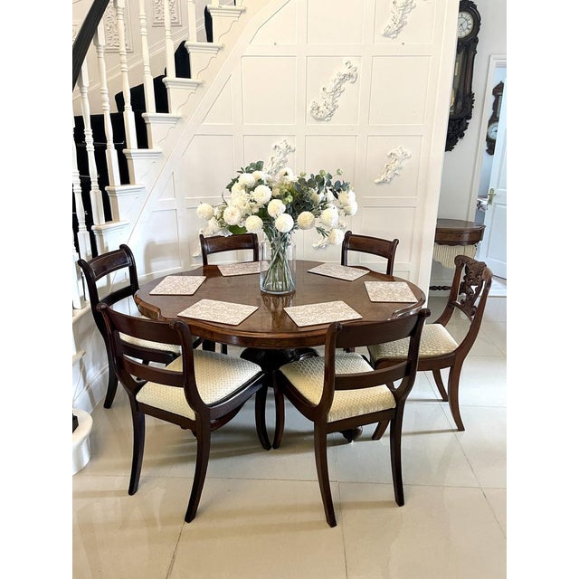 Outstanding quality antique Victorian burr walnut centre/dining table having a burr walnut serpentine shaped top with a...