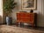 This mid-century Hekman designer chest showcases a vibrant red lacquer finish, meticulously hand-painted with gold and...