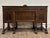 This is a stunning vintage, possibly antique, Jacobean or Tudor style carved burled oak sideboard, buffet, server, or...