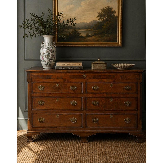 A handsome and well-proportioned George III period double chest of drawers, crafted in richly figured mahogany over a...