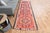Vintage Hand-Knotted runner rug is a semi-antique vintage area rug. The '70s Eastern region of Anatolia's unique rug is...