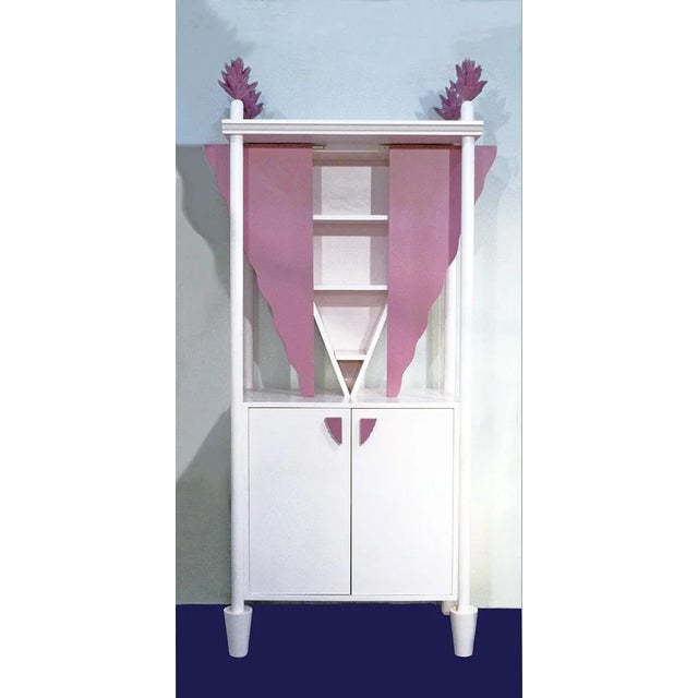 This cupboard was designed by Ugo La Pietra for F.lli Boffi in 1986. It is made of lacquered wood in white and lilac...