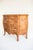 A 19th-century French Provincial three-drawer commode in the Louis XV Rococo style, crafted from solid European oak. The...