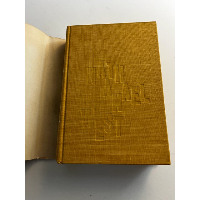 Lovely small hardcover with dust jacket, 1960 printing. The Complete Works of Nathanael West, Farrar, Strauss, & Cudahy....