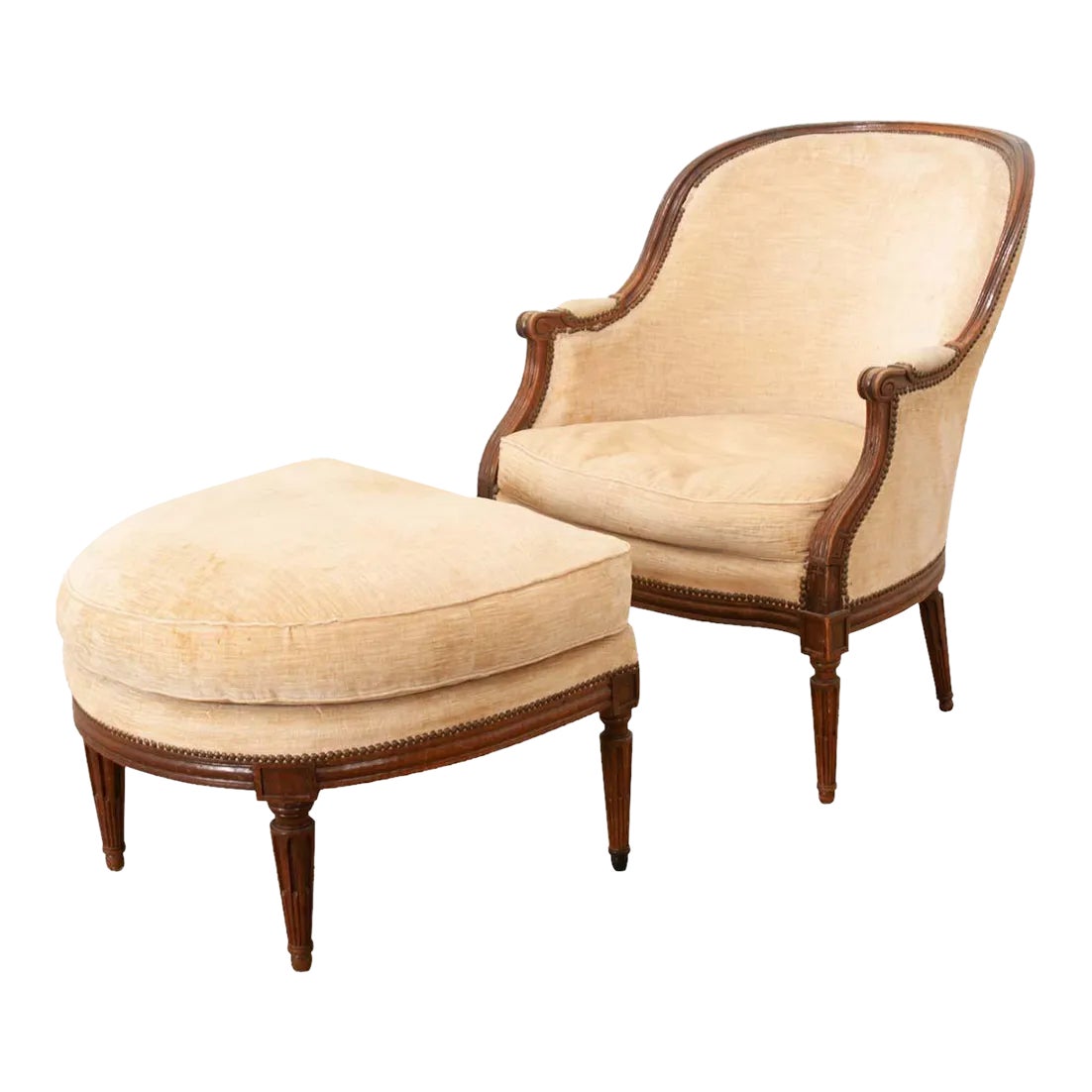 Beige upholstered lounge chair with ottoman