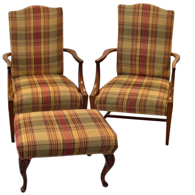 This exquisite set features a rich, warm-toned wooden frame with elegant lines and beautifully carved legs on the ottoman....