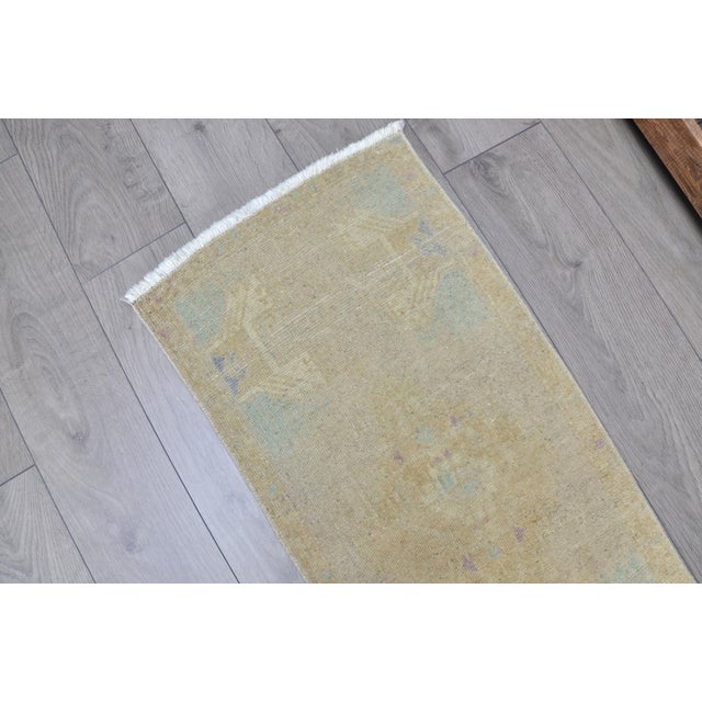 This is a vintage Turkish Oushak rug from the 1960s. The piece was hand-knotted.