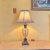 Elegant cut-crystal and bronze pineapple modern table lamp with a custom patented lamp holder and a rounded metal switch....