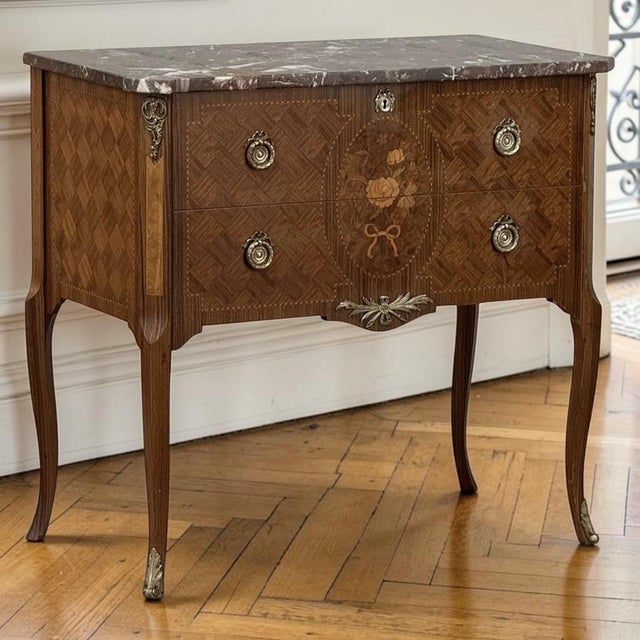 Graceful and beautifully detailed, this French Louis XVI style commode reflects the refined decorative tradition that...