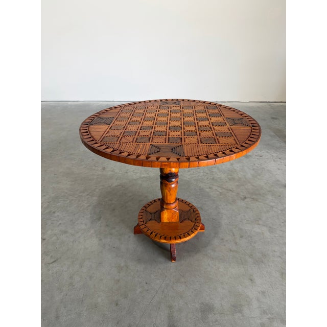 Vintage hand made Folk Art or Tramp Art side table. Chess or checker board top comprised of small pieces of wood. A...