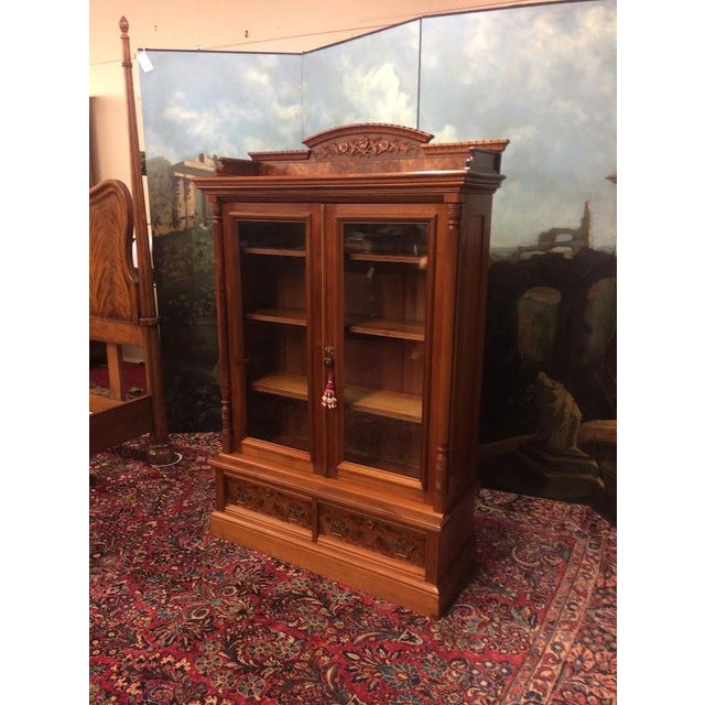 Item: Antique Walnut Bookcase with Glass Doors. Age & Condition: Circa 1890. Good condition, original finish. Someone has...