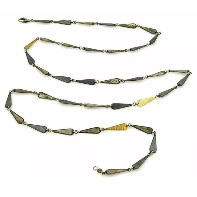 Material: 925 sterling silver & 24k yellow gold Hallmarks: Gurhan 925ag Measurements: 39" long and 6.5mm wide Weight: 34.3...