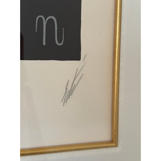 Hand-signed and numbered Erté serigraph from the Alphabet Suite, depicting the letter “N” in the artist’s signature Art...