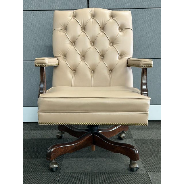 Pre-owned vintage swivel desk from the Paoli Company showcases a classic Georgian executive design. It features a high,...