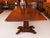 This is an elegant antique dining set that comprises an antique regency triple pillar dining table dating from c. 1830 and...