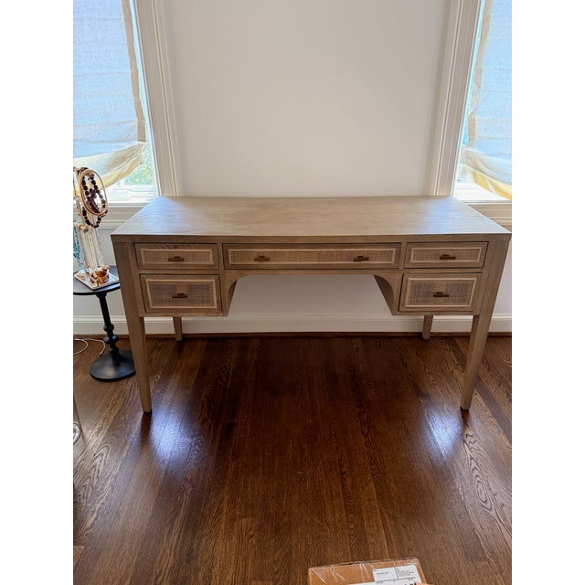 Essentials for Living Cane Desk Five storage drawers with wood bordered cane front inlay and a large work surface area....