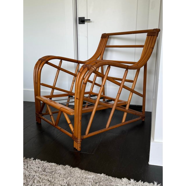 A gorgeous seat on which to rest your weary bones. This chair features 3 strand bent bamboo arms and a distinctive bent...
