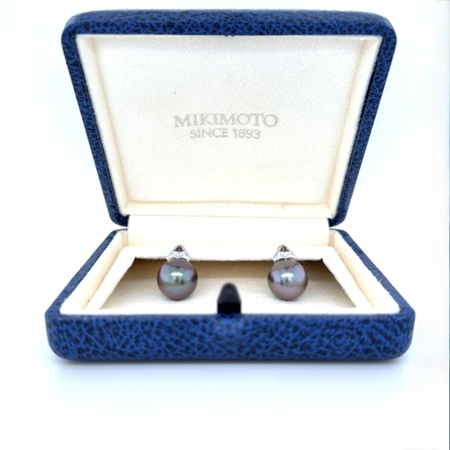 These classic Mikimoto earrings feature a signature drop design. The earrings are set with two luminous 11.00 and 12.00 mm...