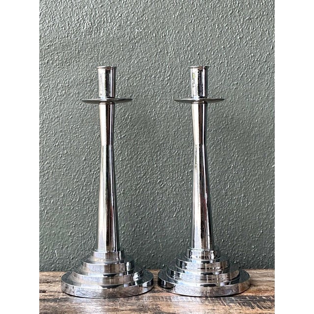 This striking pair of vintage chrome candlesticks embodies the clean lines and architectural elegance synonymous with Mid-...