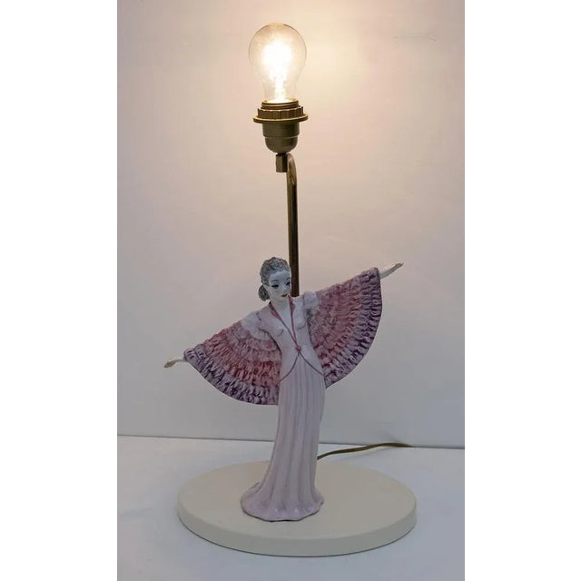 Beautiful lamp made by the famous potter Italian Tarcisio Tosin, figure of a woman in Art Nouveau style, signed by the...