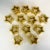 These are wonderful. We have here a set of 12 ceramic dripped gold star shaped napkin rings. Crafted in the Post Modern...