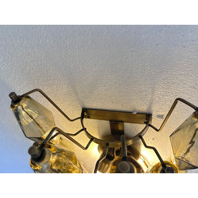 Contemporary and luxury pair of wall sconces with fumè “POLIEDRI” Murano glass . Glass elements are blown inside a wooden...