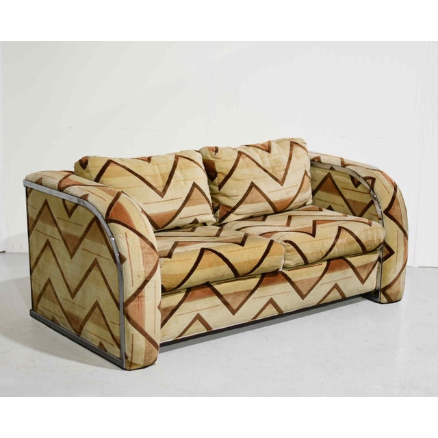 Sleek, sculptural, and unmistakably 1970s, this chrome frame loveseat features a striking sled base design paired with...