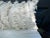 A pillow made from a Japanese boiled wool and felted textile, a down insert is included.