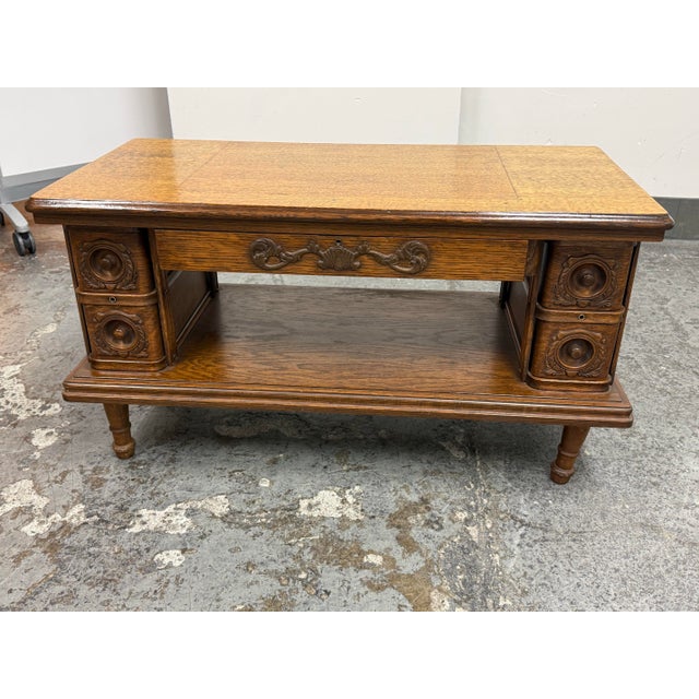 Design Plus Gallery presents a Vintage Wood Converted Sewing Machine Coffee Table. This distinctive table has been...