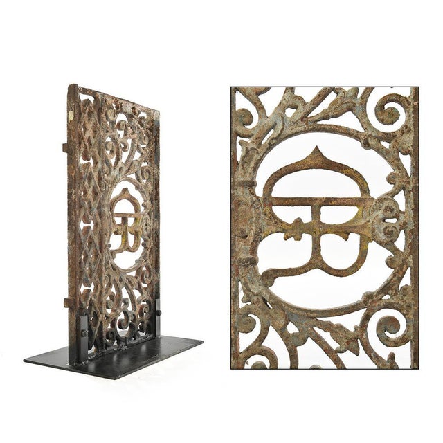 Iron railing on his foot piece of iron. Purpose of cast iron decoration. Old balcony room transformed into a decorative...