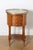 This 18th-century French side table exemplifies the refined elegance and craftsmanship characteristic of Louis XVI...