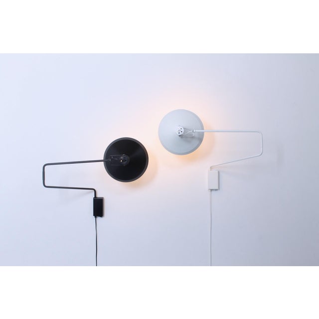 Set of two articulating metal wall lights, designed by Hoogervorst for the Anvia lighting company. Large edition;...