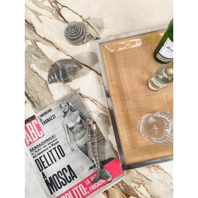 Small vintage box with a sculptural shape inspired by an architectural perspective, commonly known as “sundial shell.”...