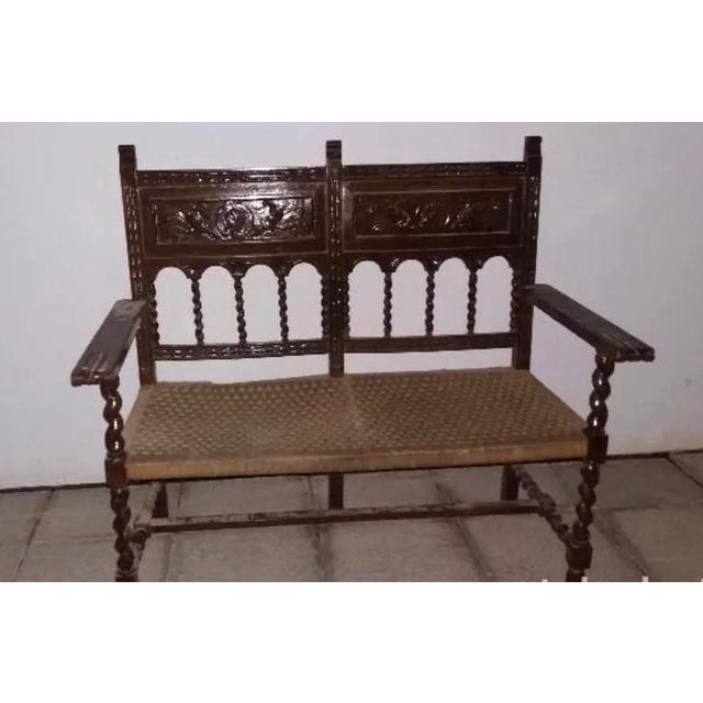 19th century Spanish console table with beautiful and rare iron stretcher. The rectangular top has carved edges, the end...