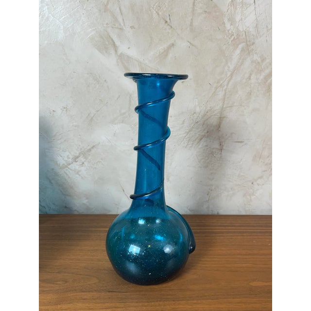Blue blown glass spiral vase in the BIOT style. Its blue color and its design with a raised spiral make it a remarkable...