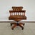 Elegant captain's chair for a Chesterfield desk, combining classic design and modern comfort. The chair is height-...