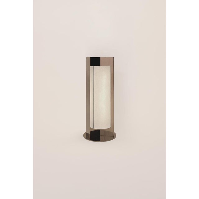 Arrow stainless steel table lamp with diffuser by violaine d'harcourt dimensions: d 8,8 x w 14 x h 40 cm. Materials:...