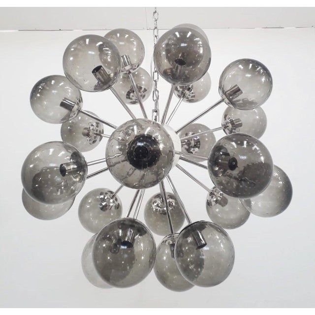 Italian sputnik chandelier with 24 smoky Murano glass globes carefully hand blown with bubbles inside the glass using...