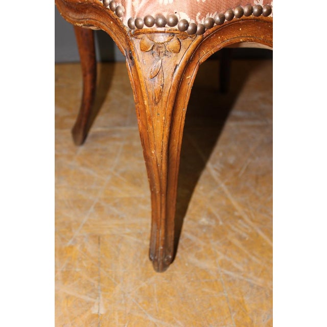 Louis XV period convertible, beech with walnut patina, flower decoration, cane model transformed and covered in fabric,...