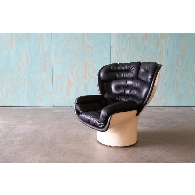 A swivel lounge chair in Fiberglass and black Leather. All original Elda Chair Designed By Joe Colombo for Comfort Italy....
