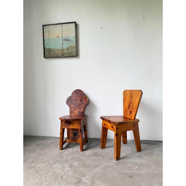 Old pair of pine wood chairs, with a very beautiful grain, and such a unique color almost reminiscent of olive wood....