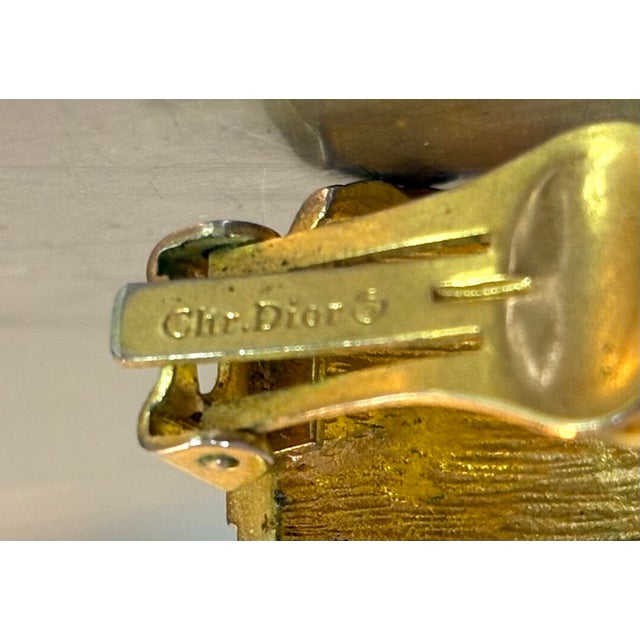 1980s-90s Christian Dior textured gold tone hoop earrings. Clip on closure. Marked at back of clip. Excellent condition.