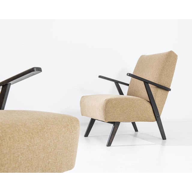 Immerse yourself in the mid-century allure with a set of two 1960s Czechia Wooden Armchairs. Upholstered in a timeless...