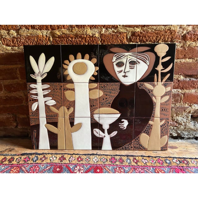 A ceramic mural by artist Susana Espinosa. Tile on plywood. 24" by 18." Configured to hang. Quite heavy.
