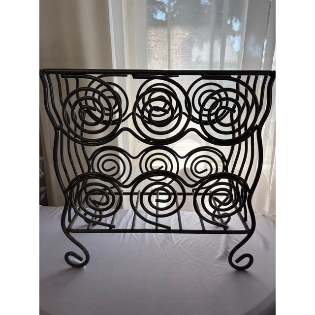 This magazine rack from the 1970's if made of pewter. While primarily used for magazines, these metal holders are also...