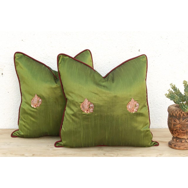 Crafted in India from a lustrous silk-blend textile, this pillow cover is embellished by hand with traditional Zardozi-...