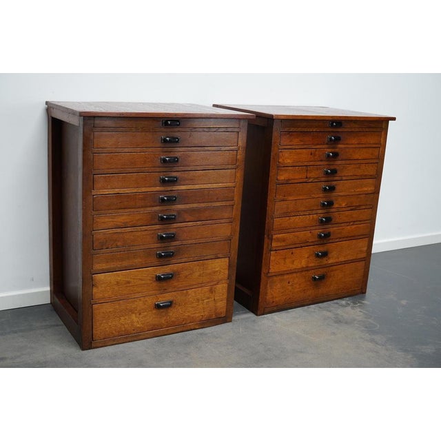 These jewelers / watchmakers cabinets were designed and made circa 1930/1940 in the Netherlands. They feature 10 oak...