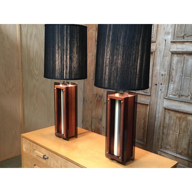 Pair of Mid Century table lamps with night light in the base for mood lighting.